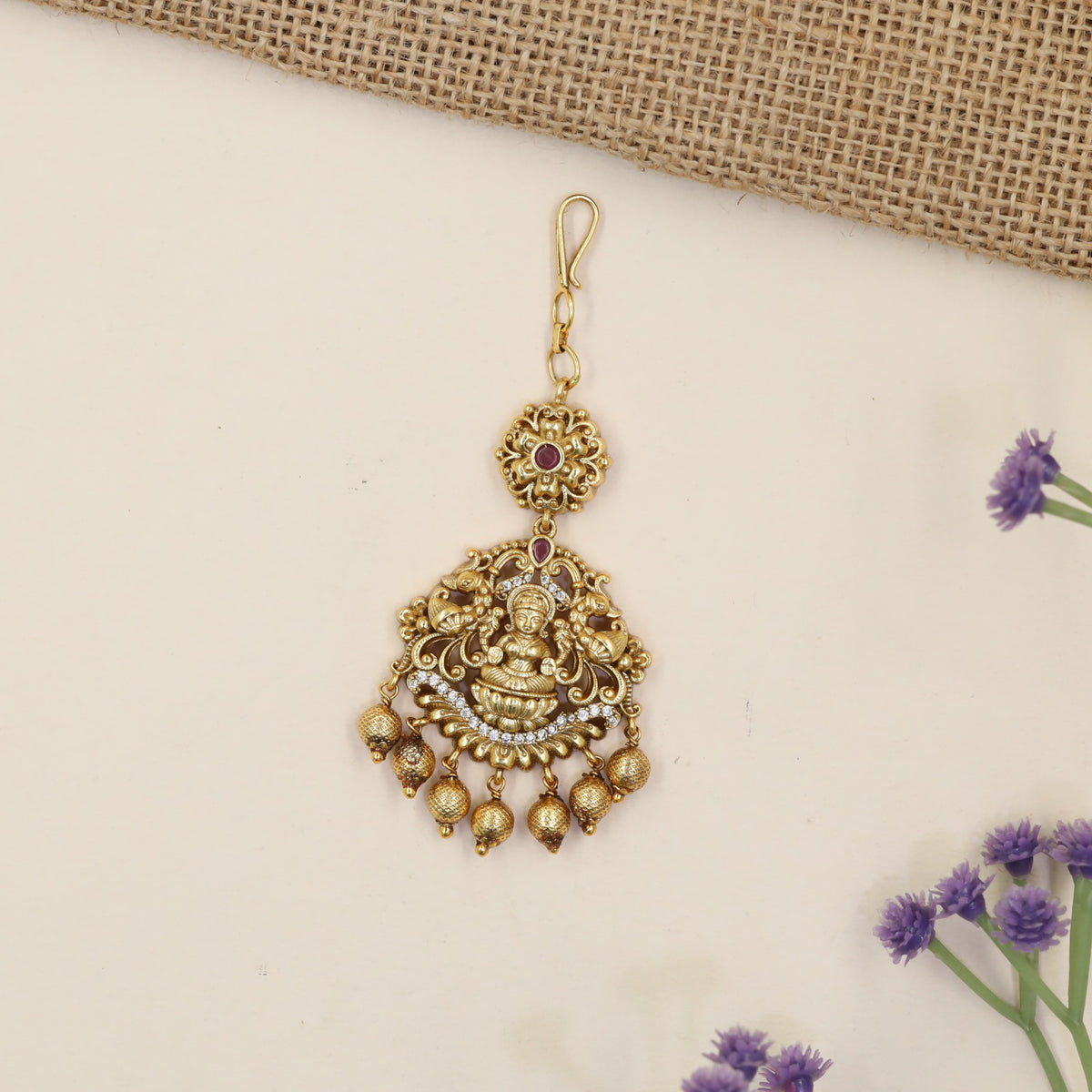 Antique Tikka with Lakshmi Centrepiece and Elaborate Floral Detailing