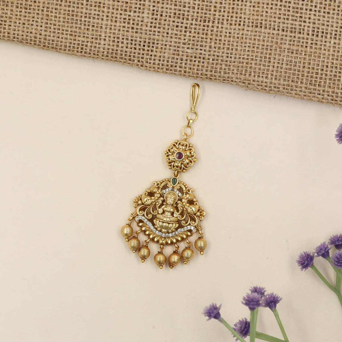 Antique Tikka with Lakshmi Centrepiece and Elaborate Floral Detailing