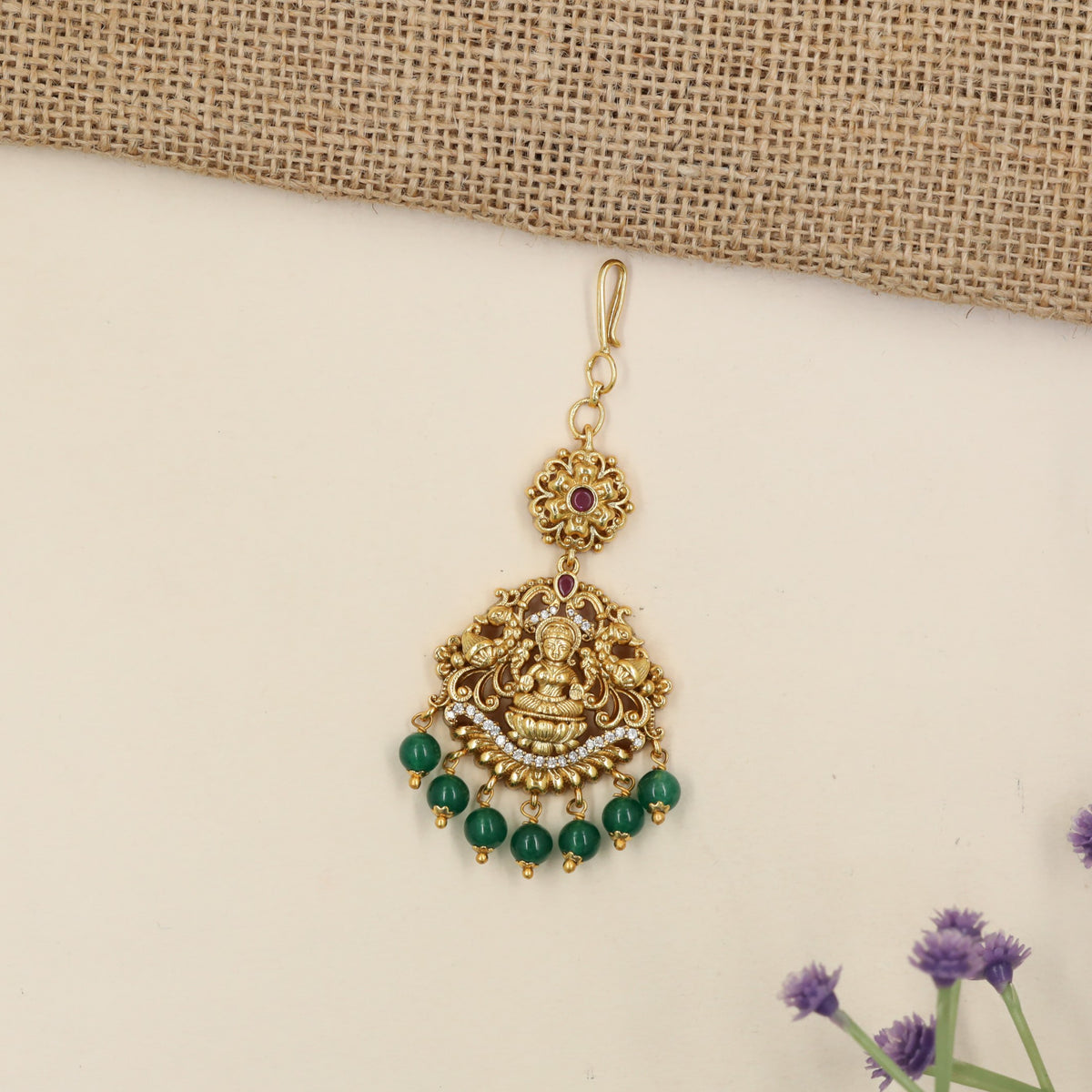Antique Tikka with Lakshmi Centrepiece and Elaborate Floral Detailing