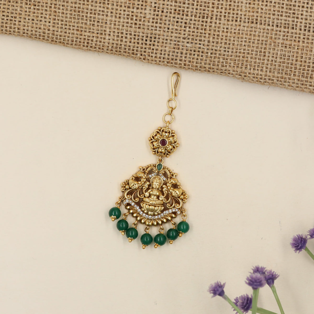 Antique Tikka with Lakshmi Centrepiece and Elaborate Floral Detailing
