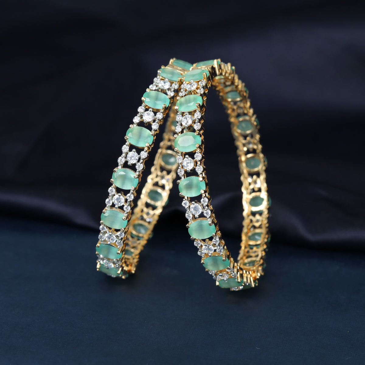 Gj Bangles showcasing Alternating Oval Settings with Intricate Openwork