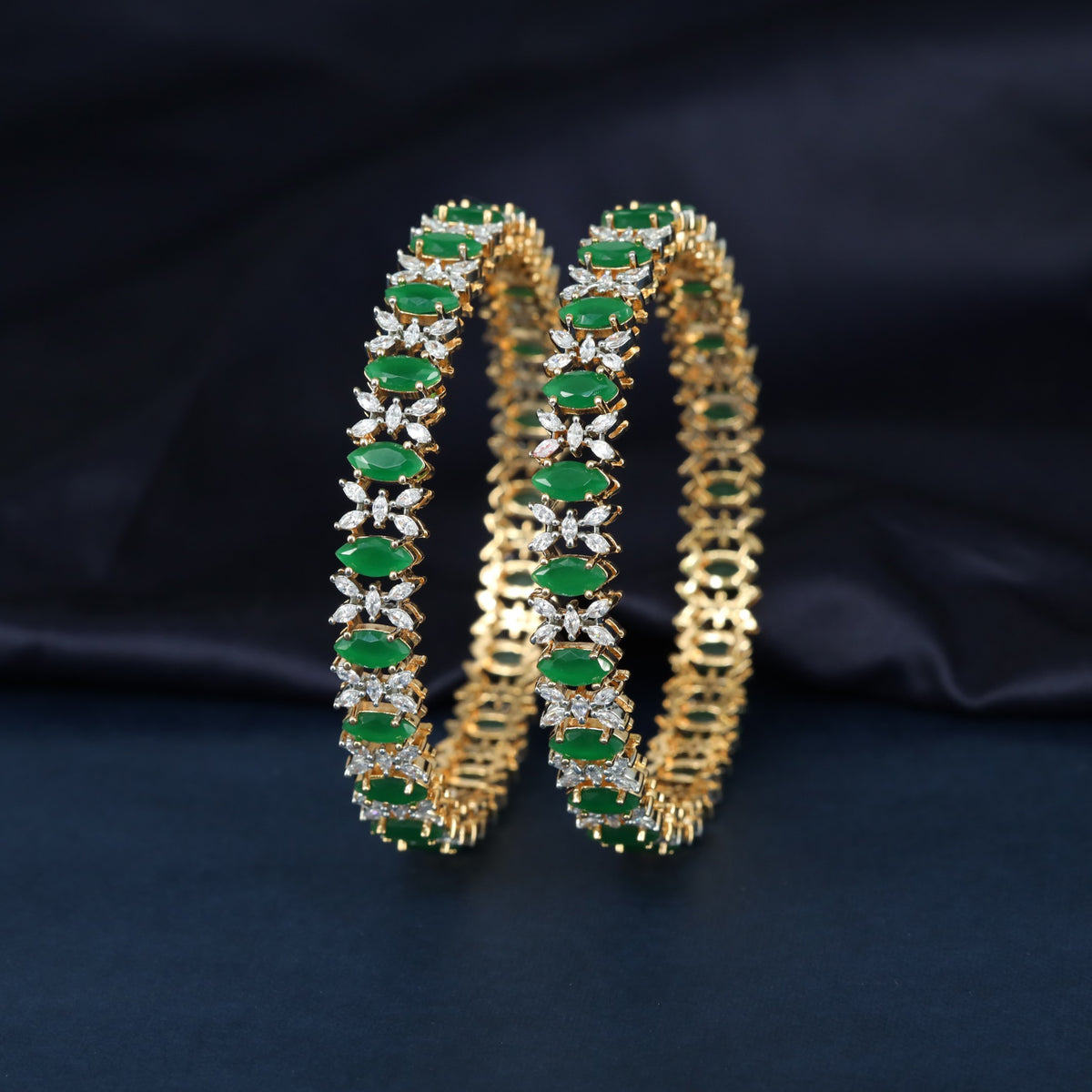 Fine Cluster Work surrounds the Oval Settings on these Gj Bangles
