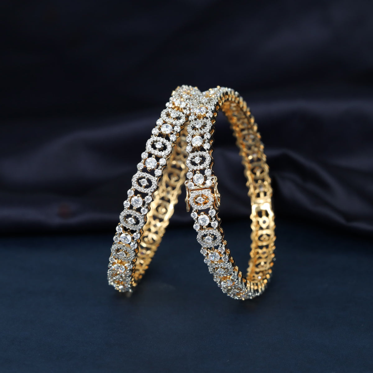 Gj Bangles with Closely Arranged Circular Motifs and Delicate Stone Settings