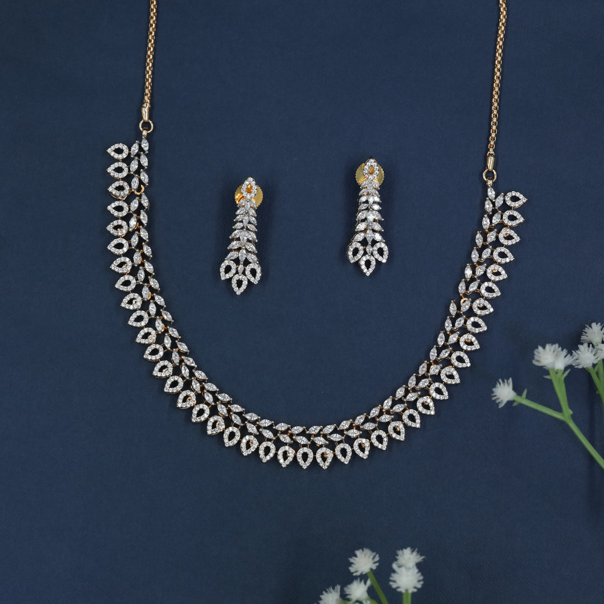 Gj Necklace with Repeating Leaf Shapes and Teardrop Details