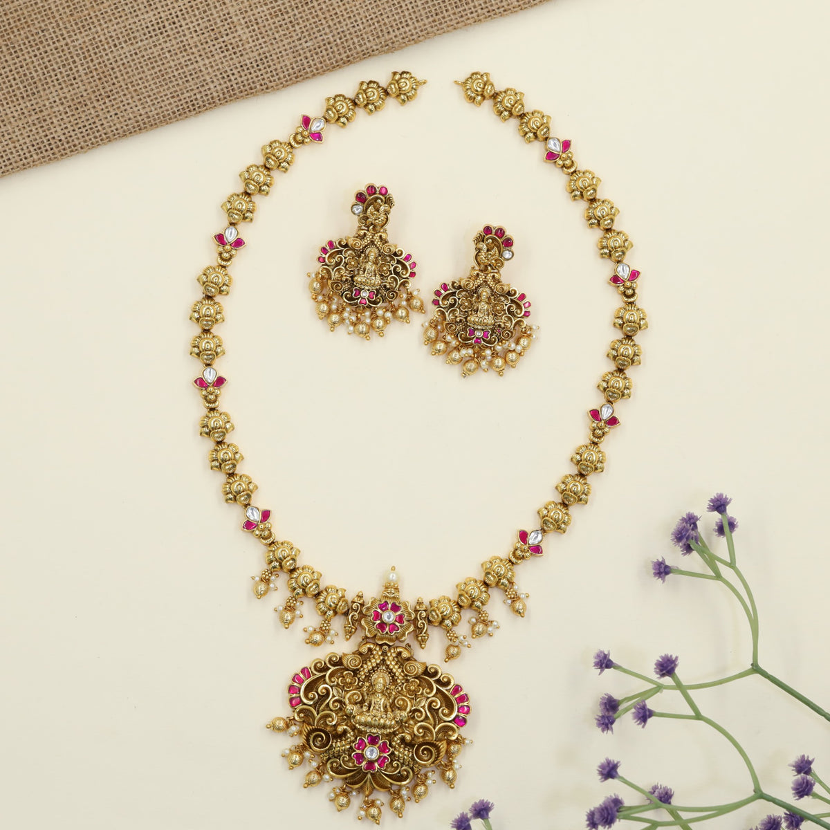 Royal Antique Long Haar featuring a prominent Lakshmi pendant
