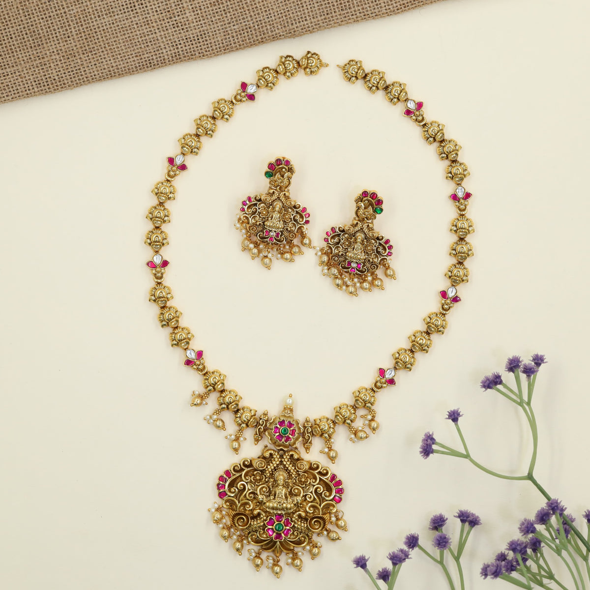 Royal Antique Long Haar featuring a prominent Lakshmi pendant