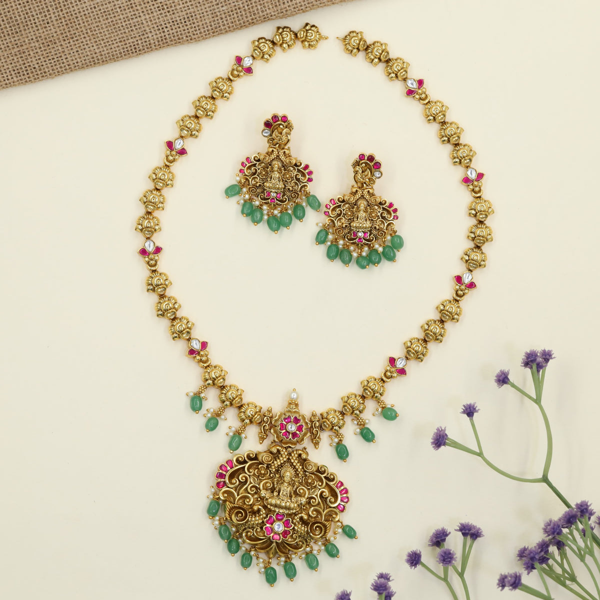Royal Antique Long Haar featuring a prominent Lakshmi pendant