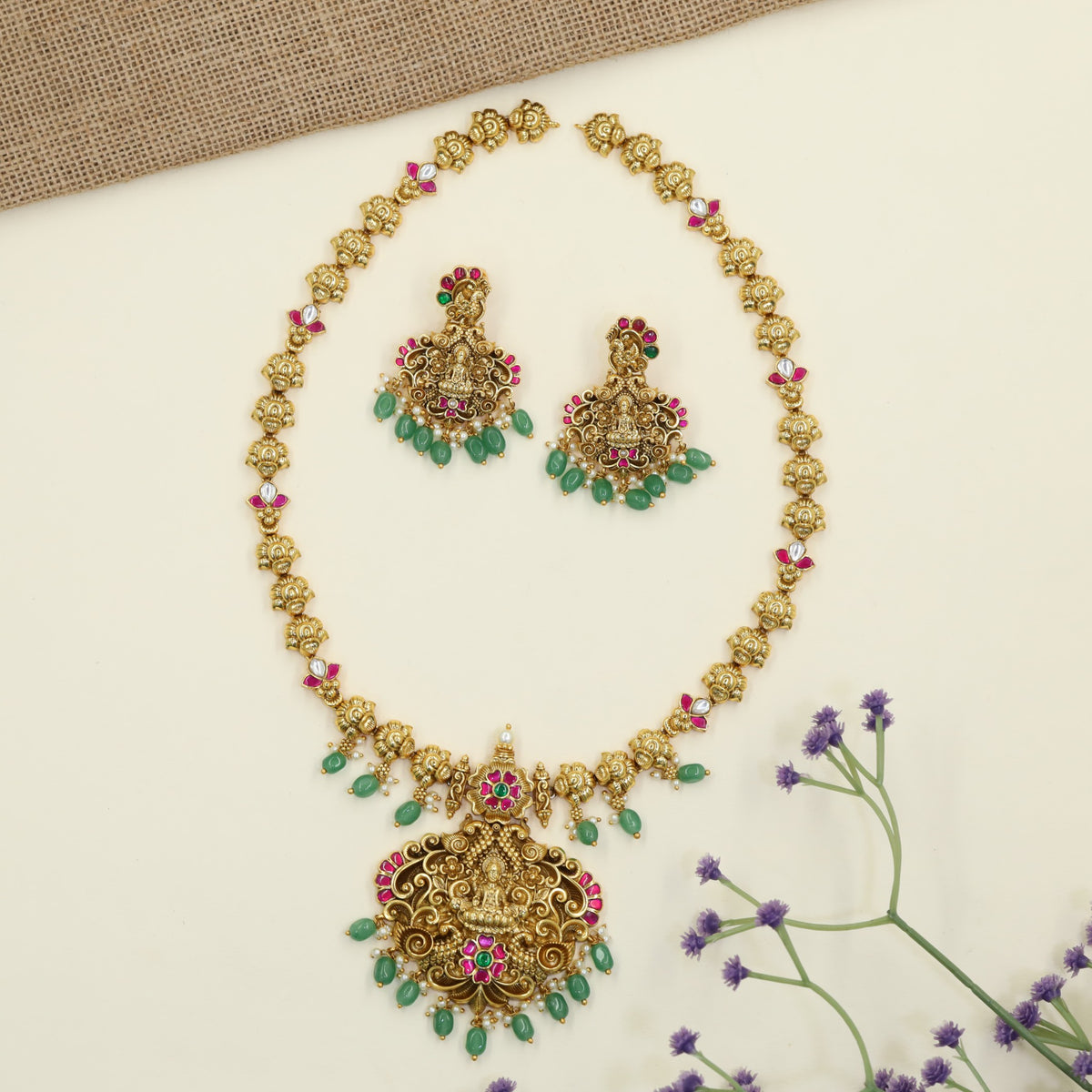 Royal Antique Long Haar featuring a prominent Lakshmi pendant