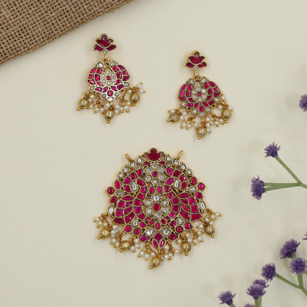 Jadau Pendant featuring intricate peacock detailing and matching earrings
