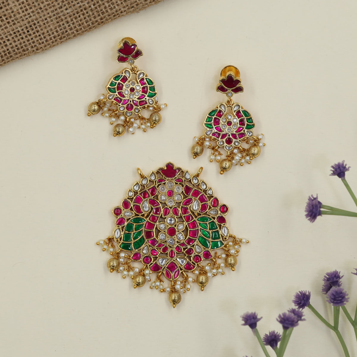 Jadau Pendant featuring intricate peacock detailing and matching earrings