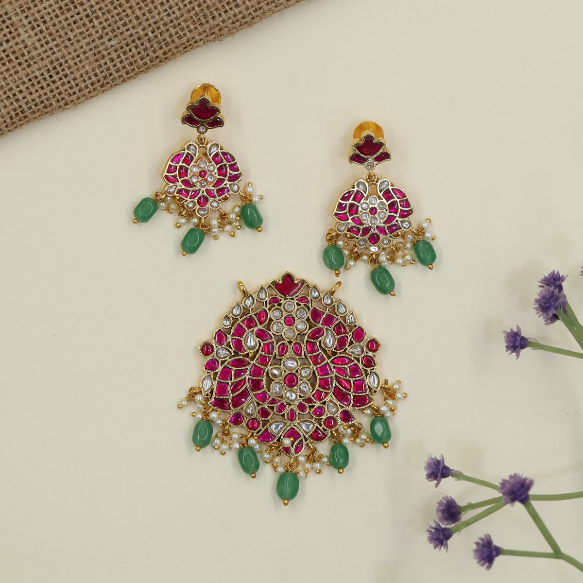Jadau Pendant featuring intricate peacock detailing and matching earrings