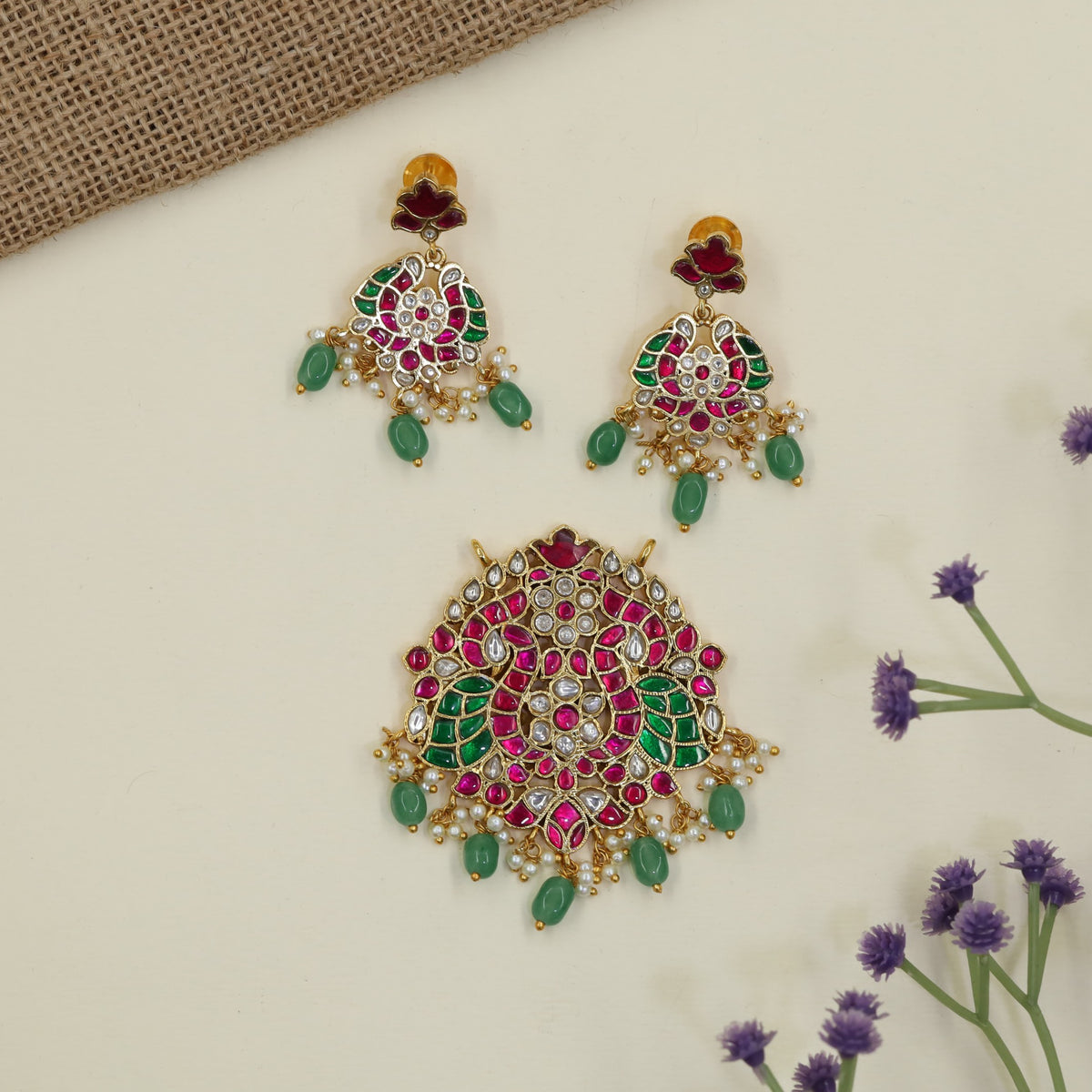 Jadau Pendant featuring intricate peacock detailing and matching earrings