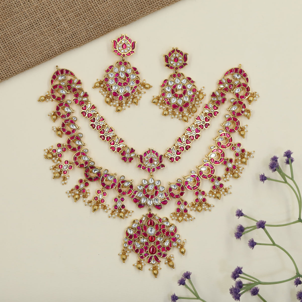 Jadau Necklaces with floral detailing and ornate pendants