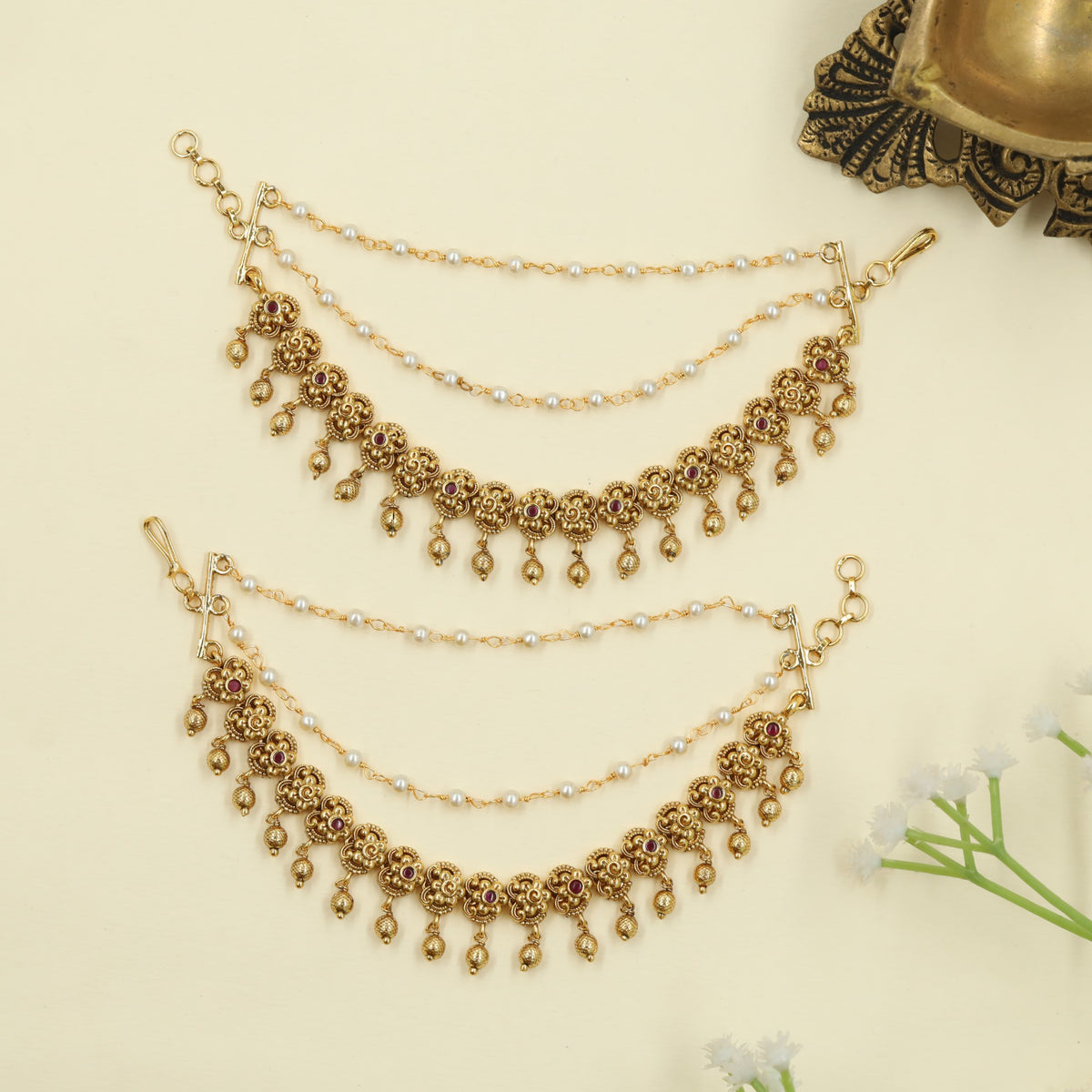 Antique Mati with floral link and hanging drop detailing