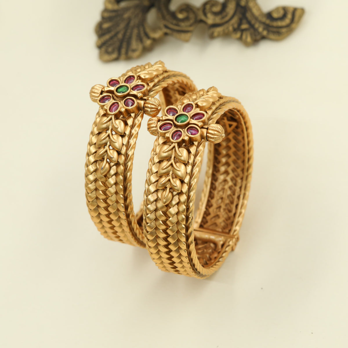 Antique Bangles featuring a floral centre with raised leaf detailing