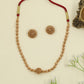 Antique beads necklace with ornate central bead design