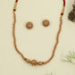 Antique beads necklace with ornate central bead design