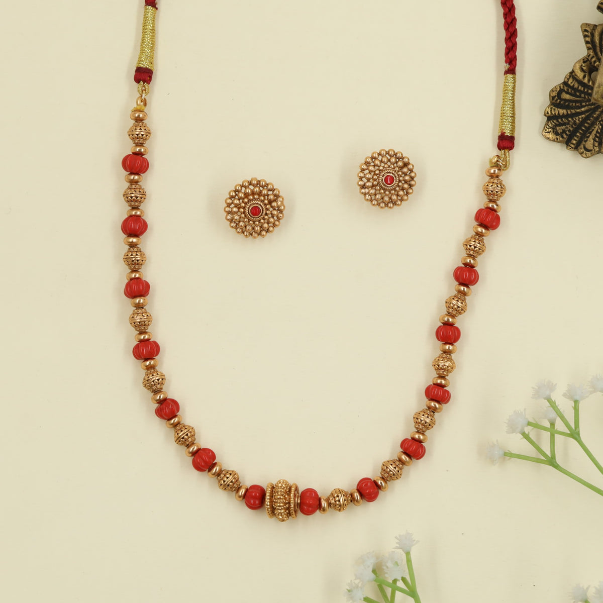 Antique Beads Necklace featuring rounded bead sections and textured links