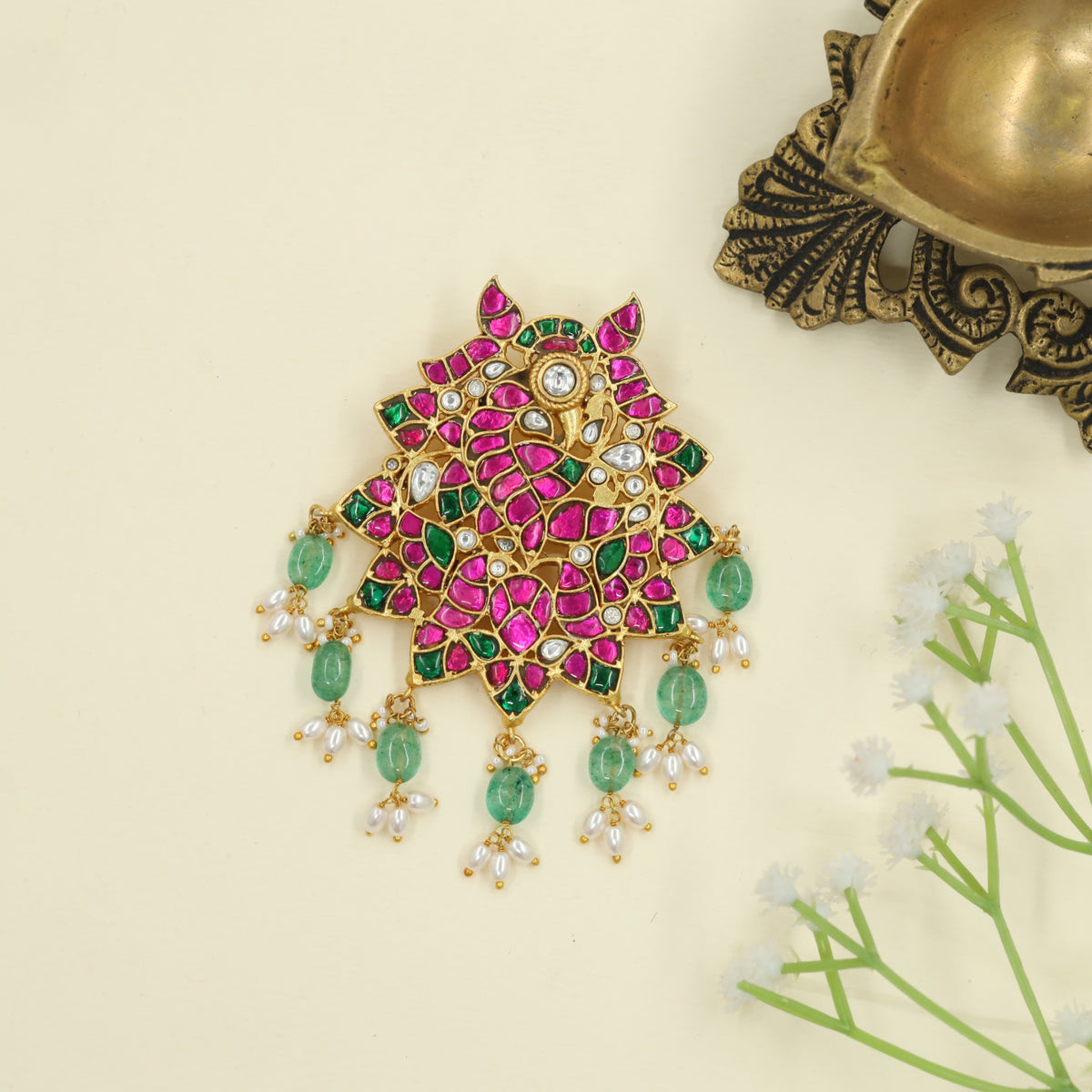 Couture Jadau pendant framed in Peacock design