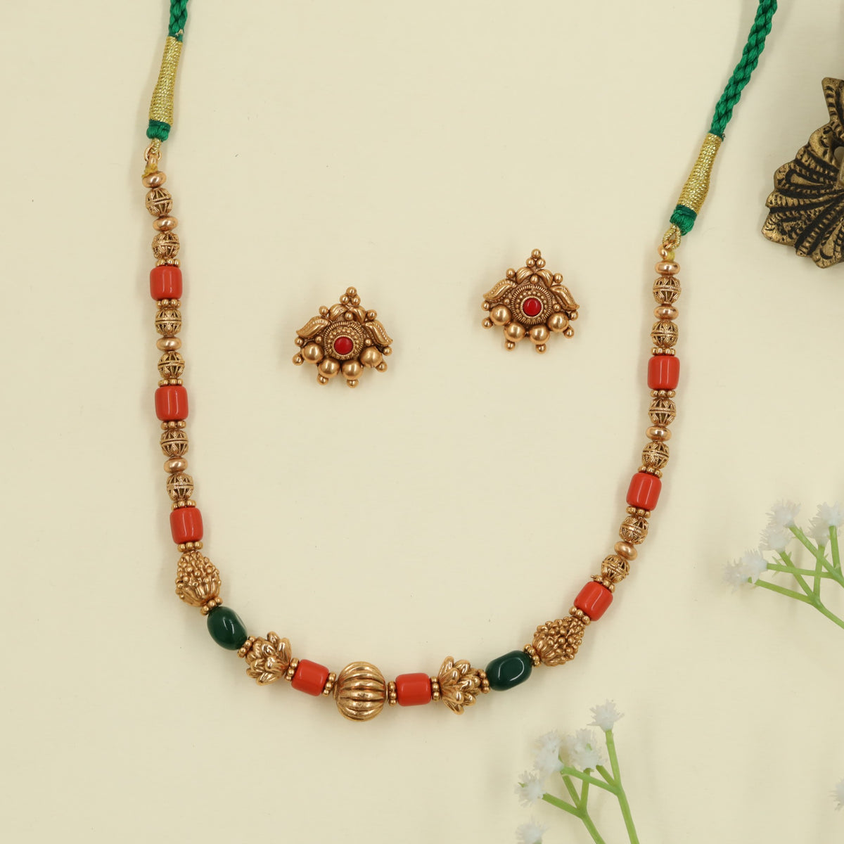 Antique Beads Necklace featuring elongated beads and floral connectors