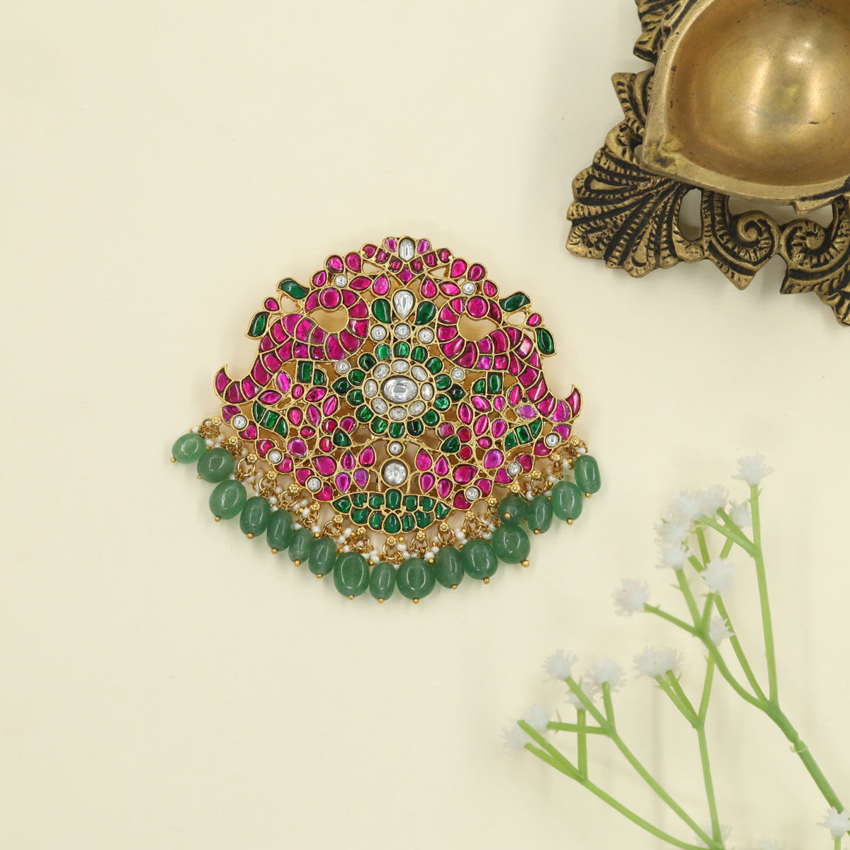 Jadau Pendant featuring peacock figures and suspended beadwork