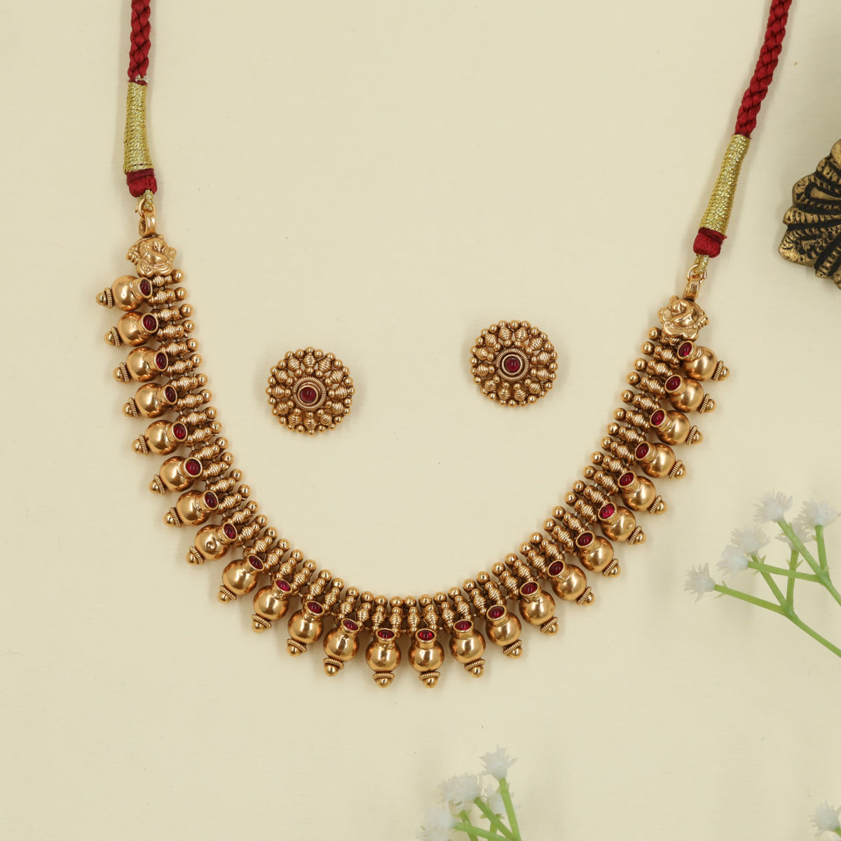 Antique Necklace with repeated bead drops and floral connectors