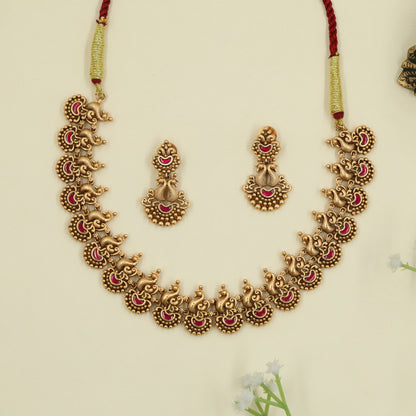 Festive antique necklace emphasizing refined peacock detailing