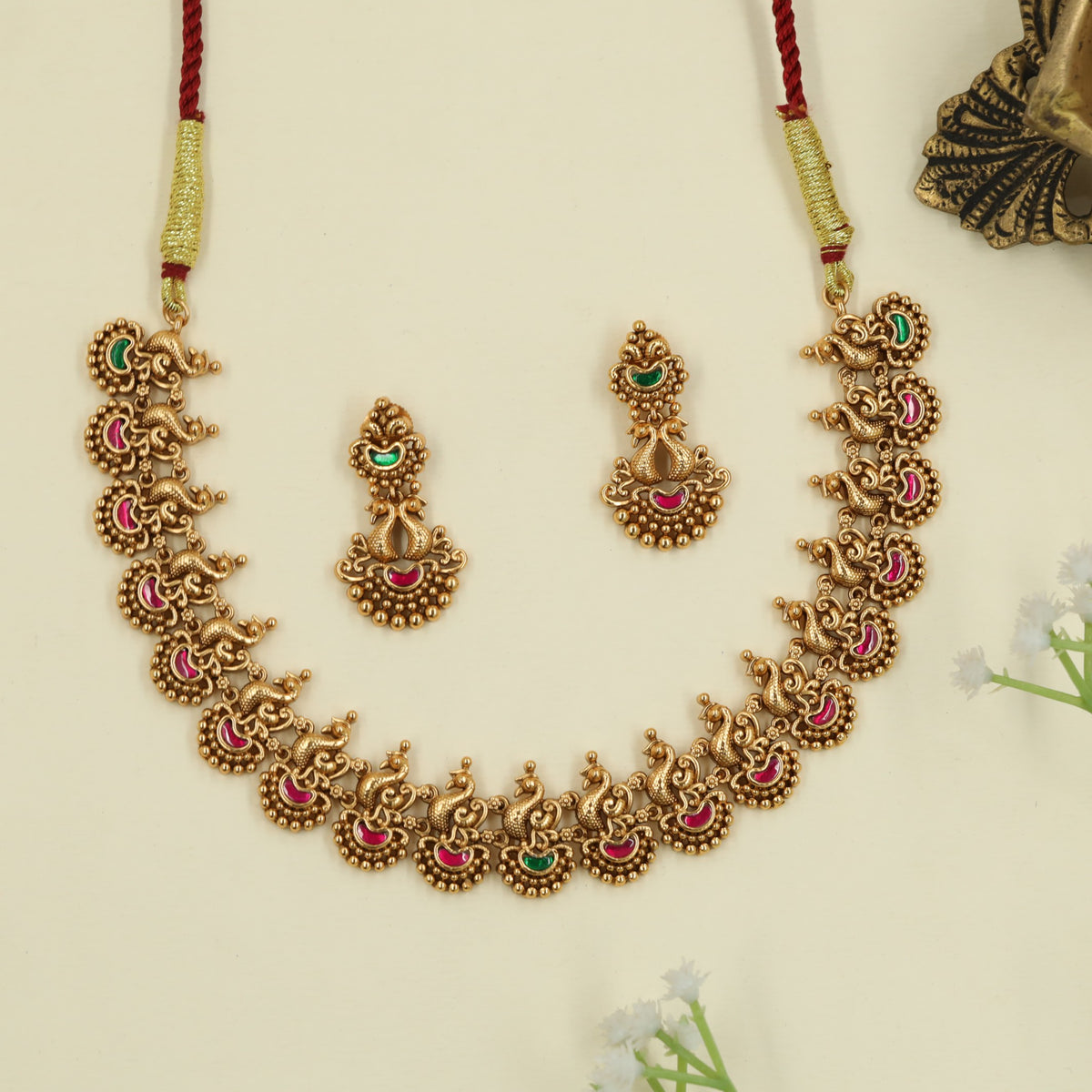 Festive antique necklace emphasizing refined peacock detailing
