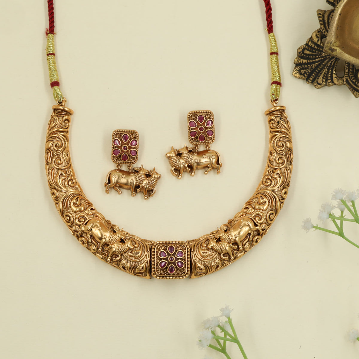 Elegant antique necklace with cow carvings