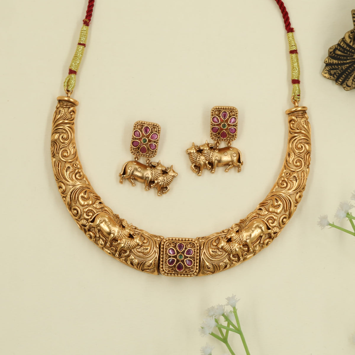 Elegant antique necklace with cow carvings