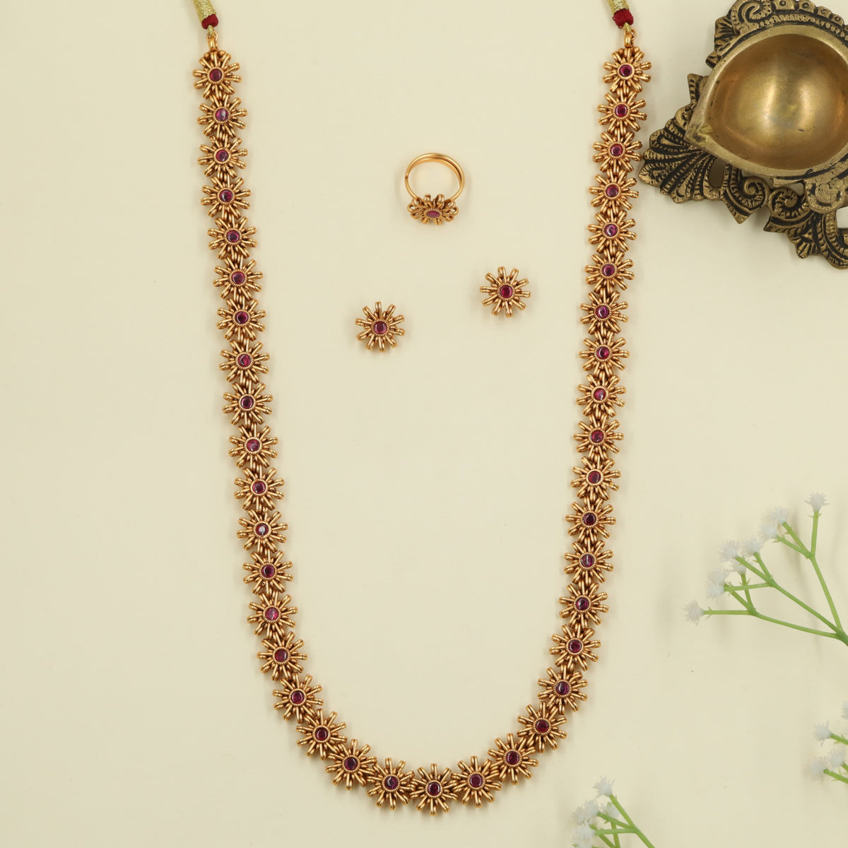Couture antique long haara featuring symmetrical floral framework