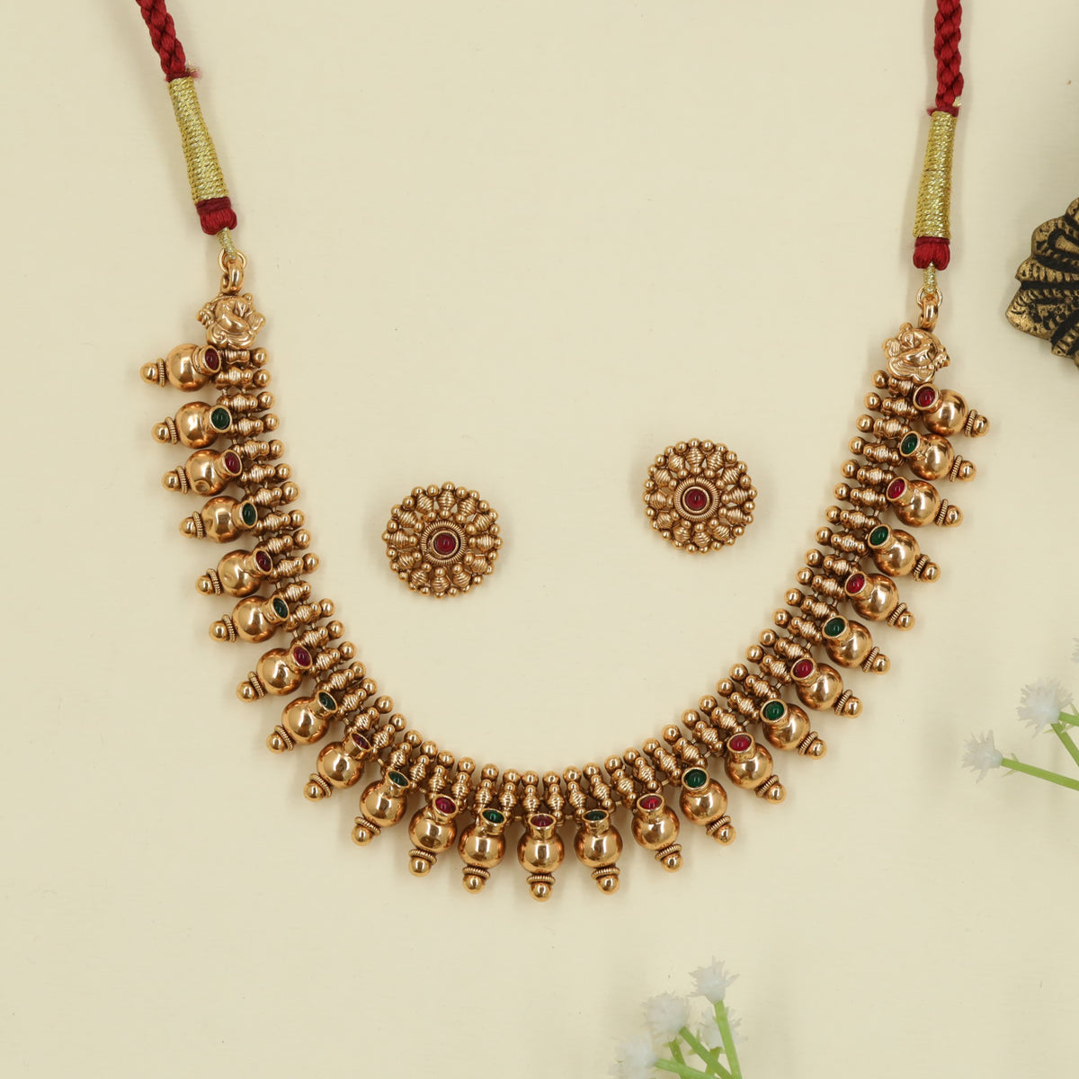 Antique Necklace with repeated bead drops and floral connectors