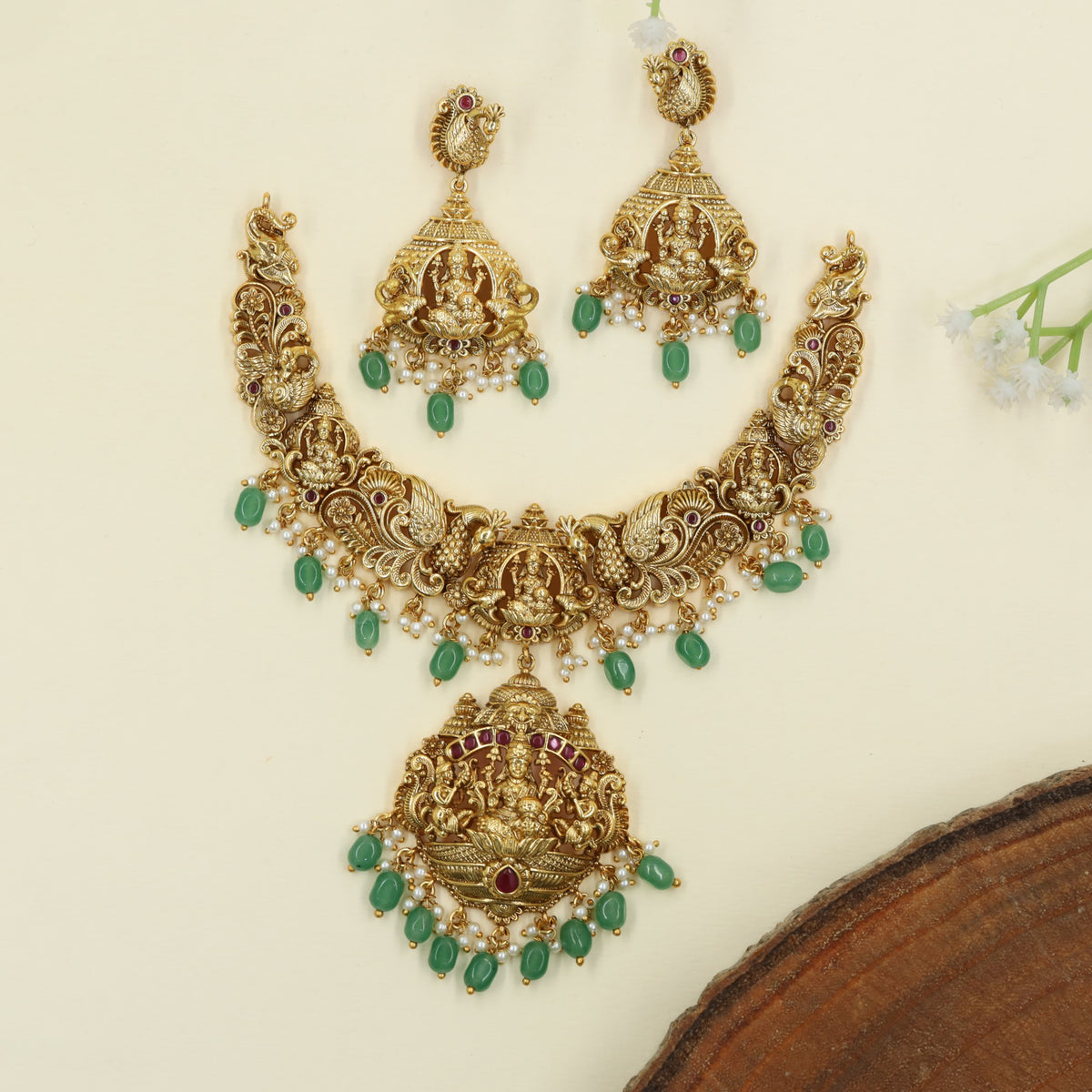 Traditional Lakshmi design framed by detailed peacock elements