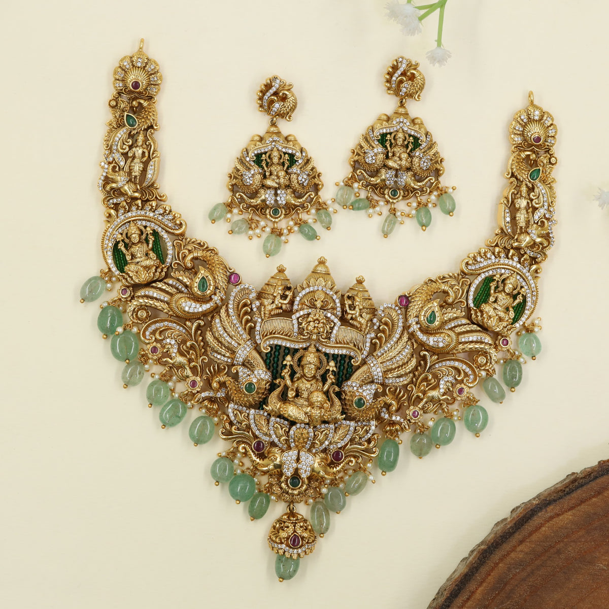 Traditional necklace design with Lakshmi figures and floral scrollwork