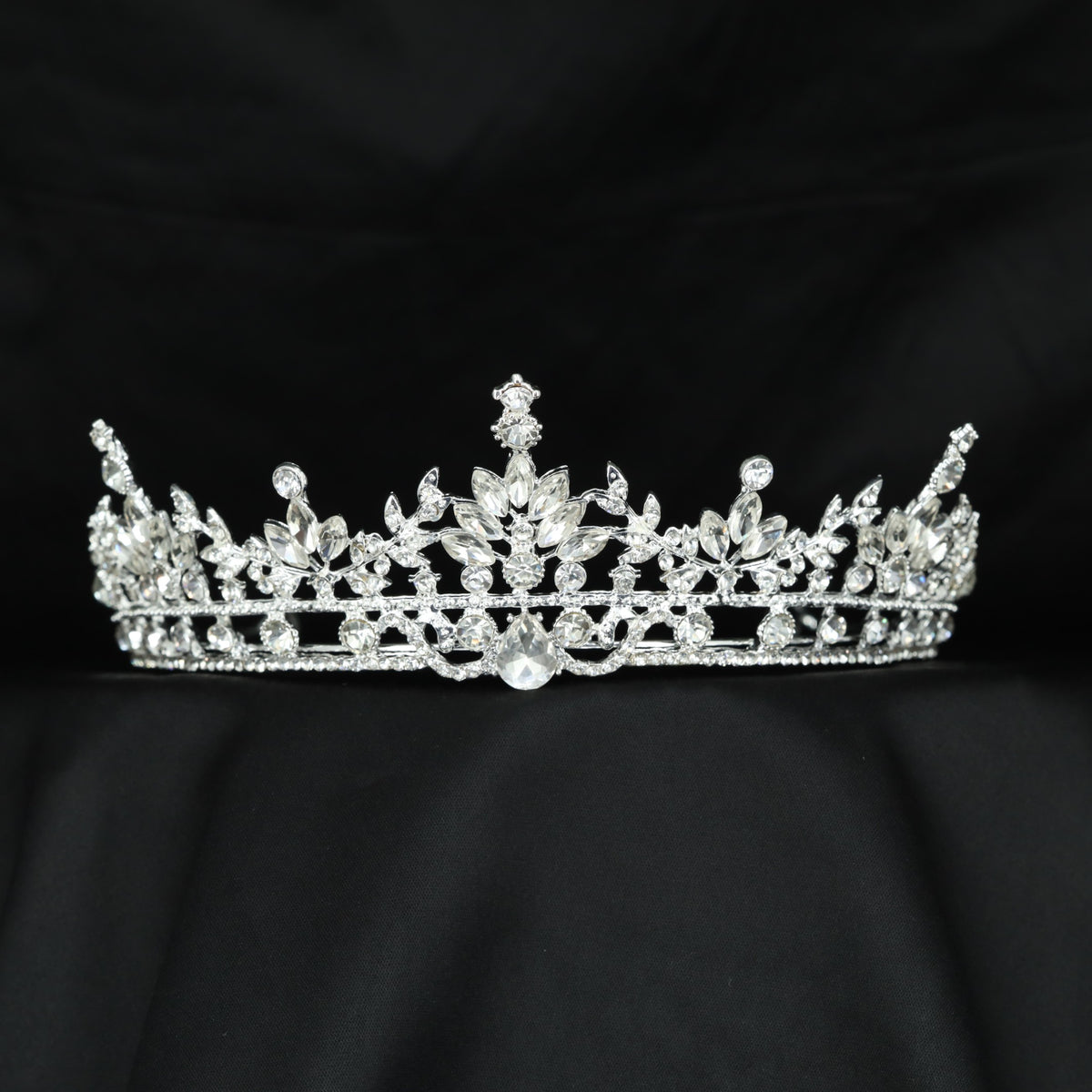 Delicate Crown featuring sculpted leaves, floral accents and symmetrical openwork