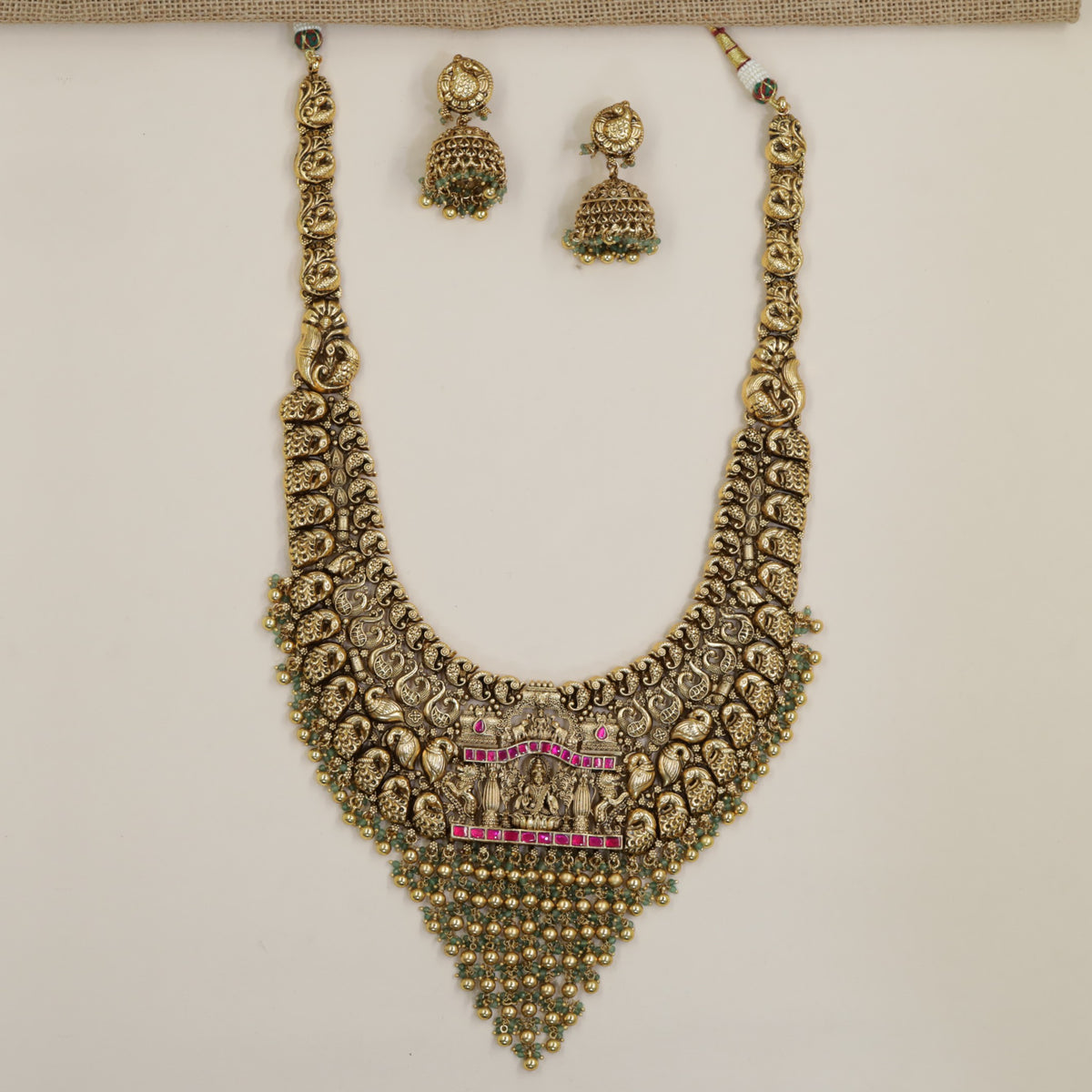 Antique Long Haara with a detailed Lakshmi figure and repeated decorative elements