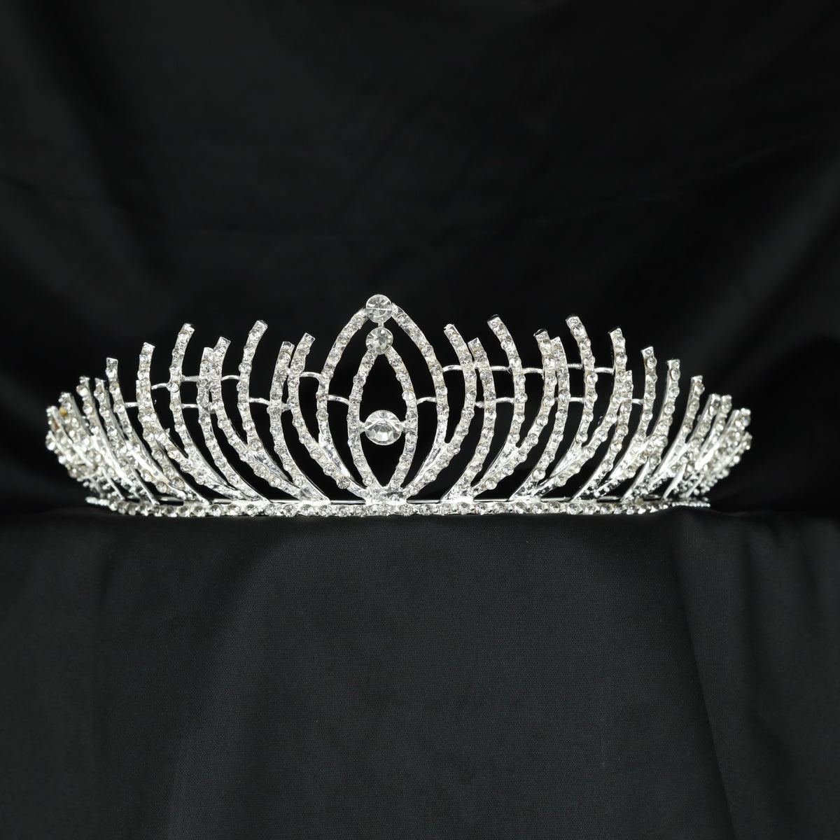 Modern Crown featuring curved openwork and a raised centre