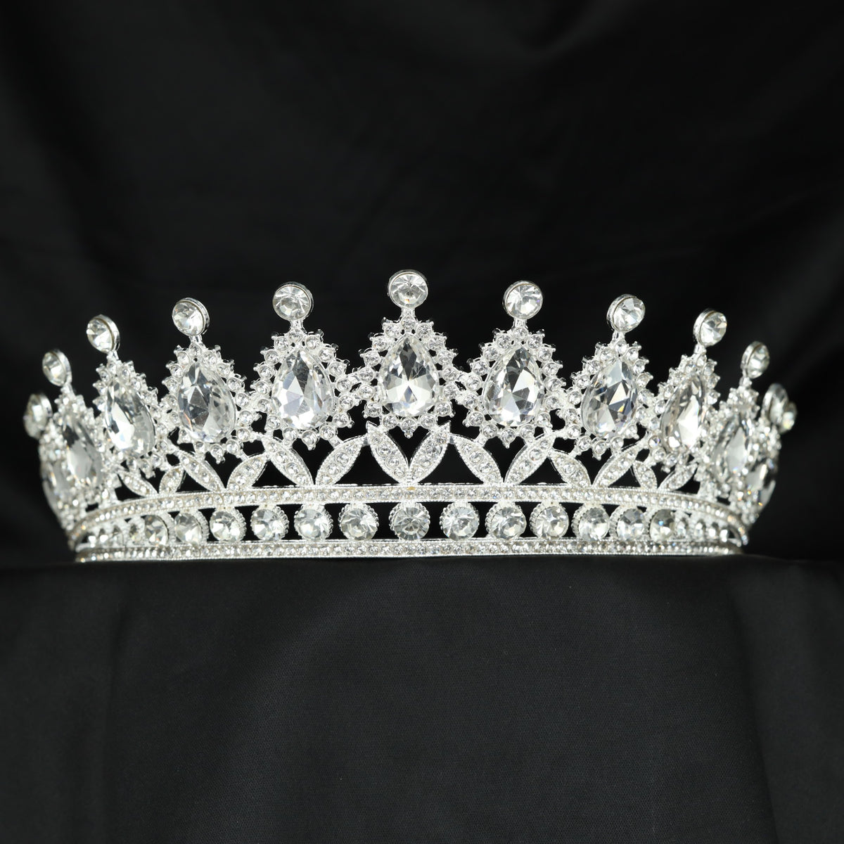 Elegant teardrop frame Crown with refined openwork detailing