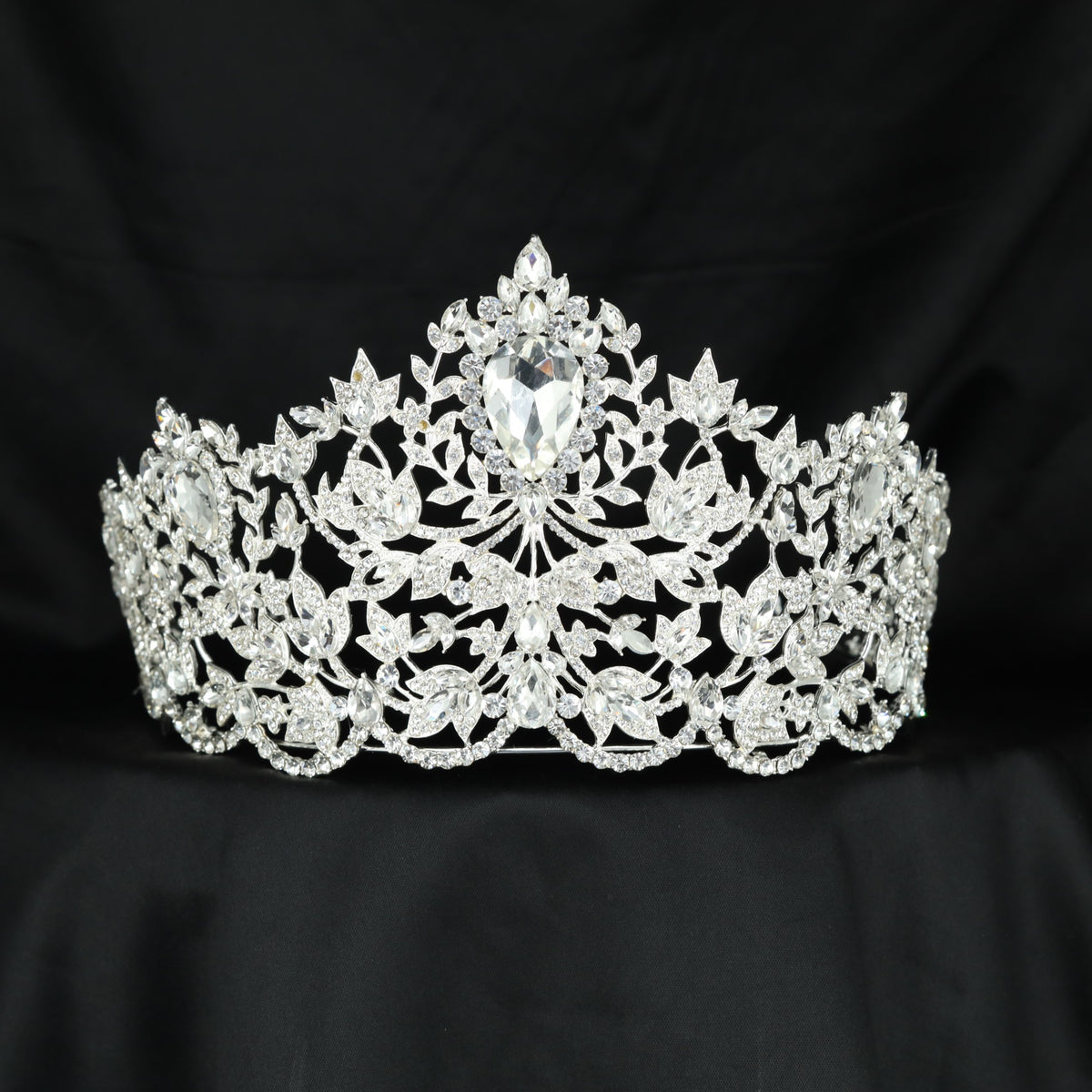 Artful Crown design featuring elegant leaf clusters and a striking central drop