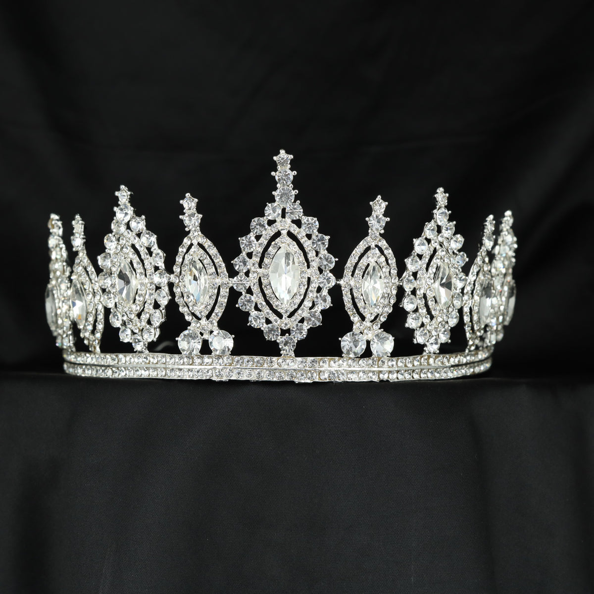 Beautifully structured Crown featuring floral arrangements and an elongated central frame