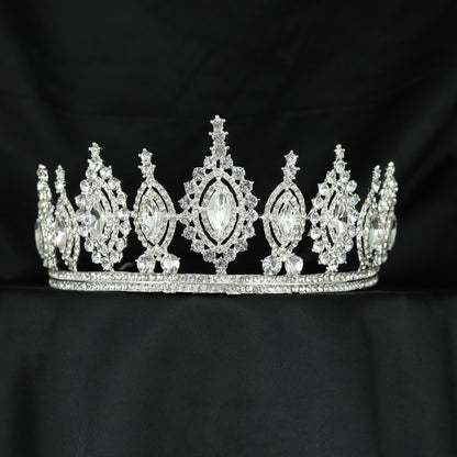 Beautifully structured Crown featuring floral arrangements and an elongated central frame