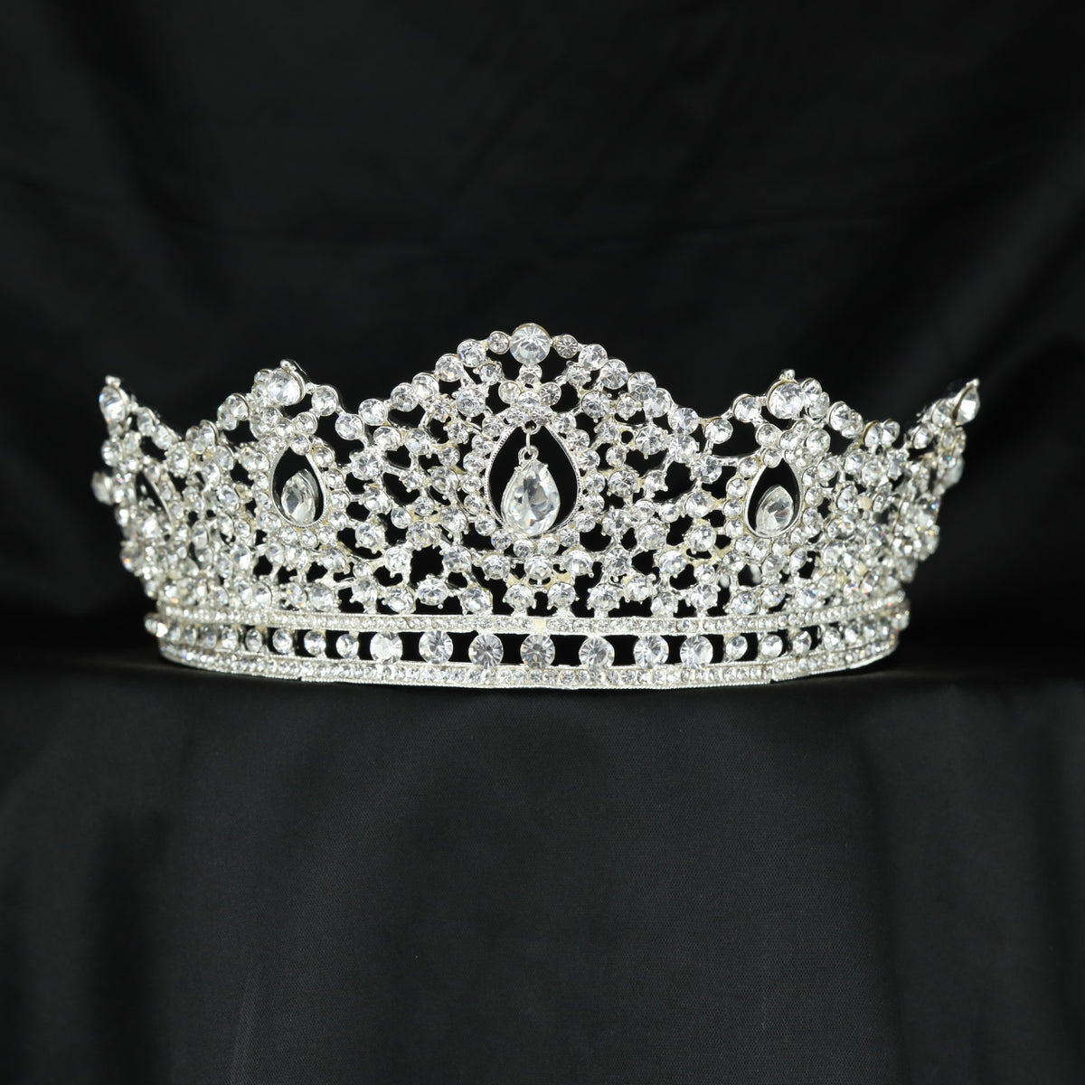 Occasion wear Crown featuring a prominent open centre with delicate surrounding details