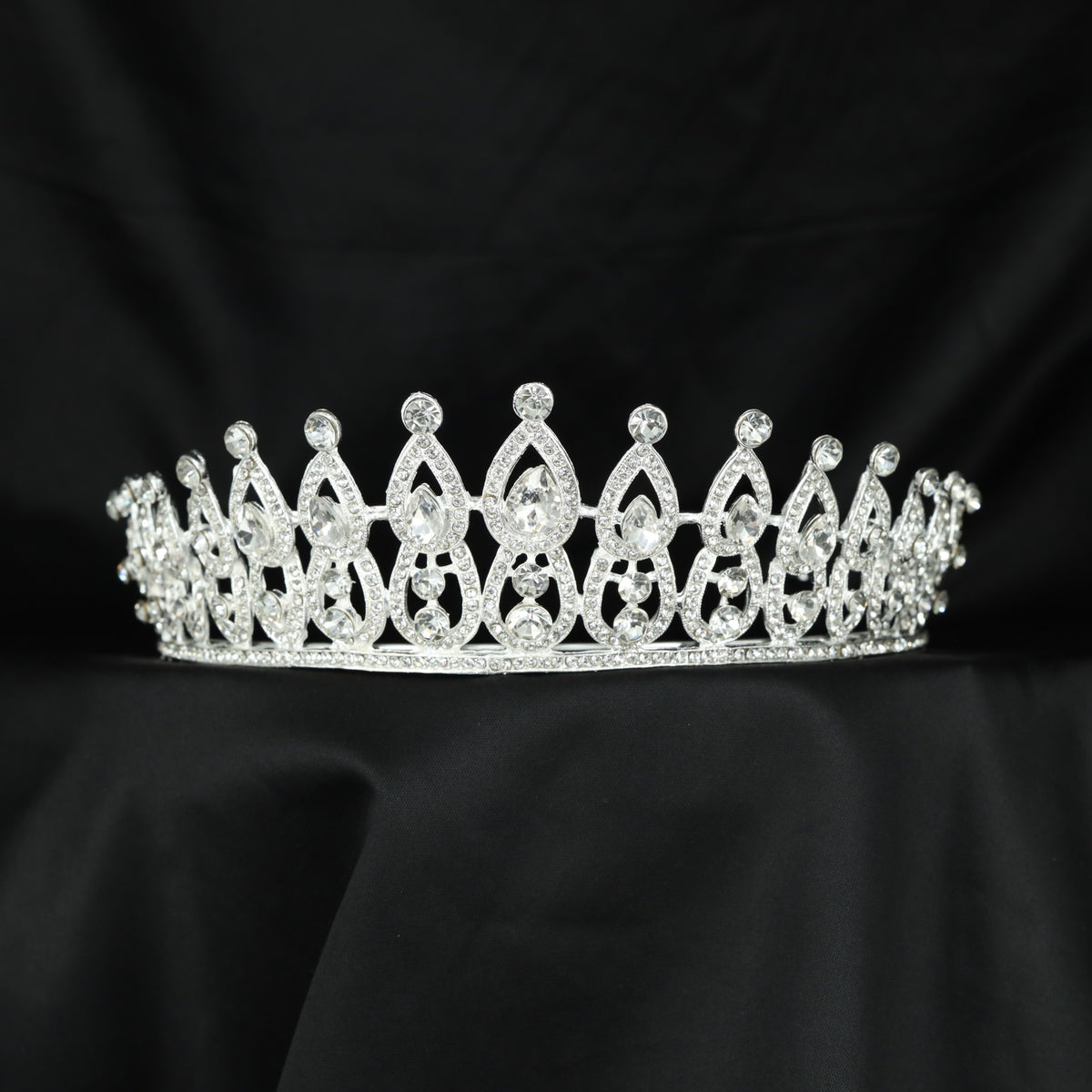 Graceful Crown featuring pointed frames, openwork sections and raised accents