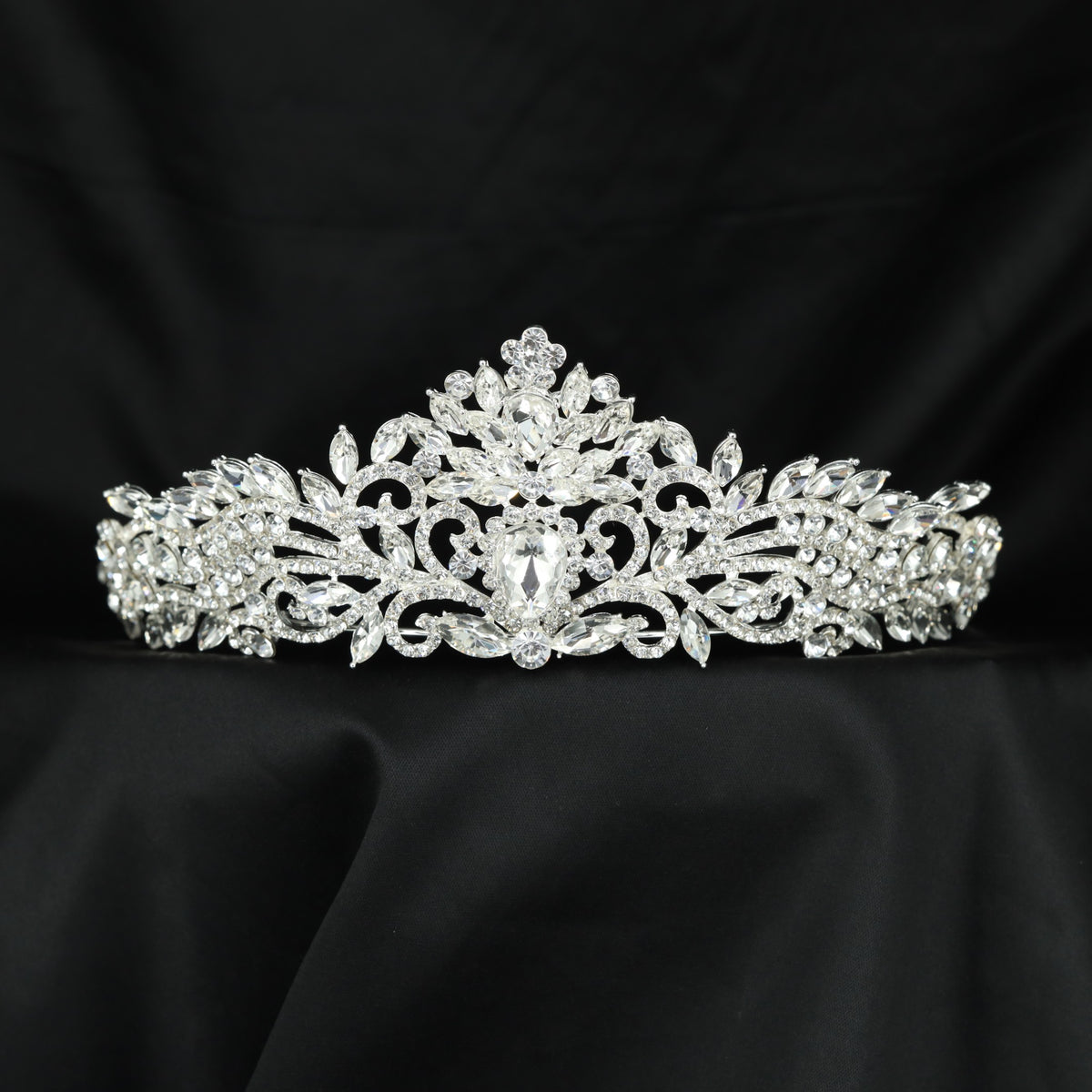 Signature Crown crafted with delicate foliage details and refined openwork