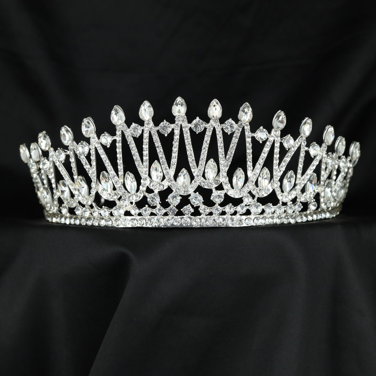 Grand Crown featuring graceful openwork arches and raised details