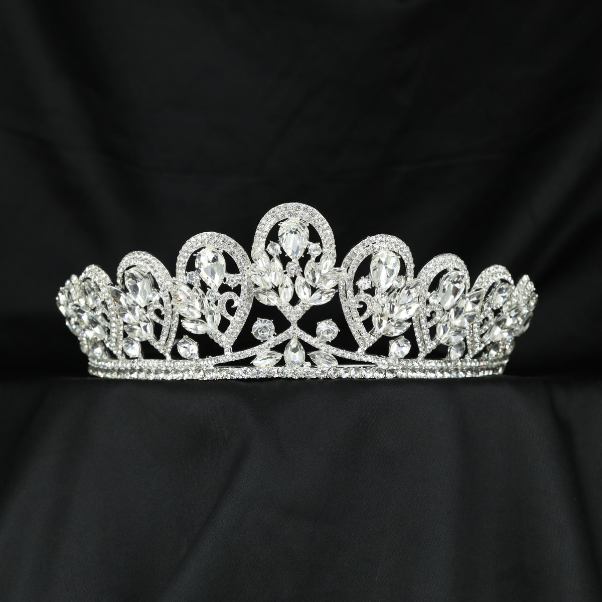 Grand Crown featuring graceful openwork arches and elongated raised details