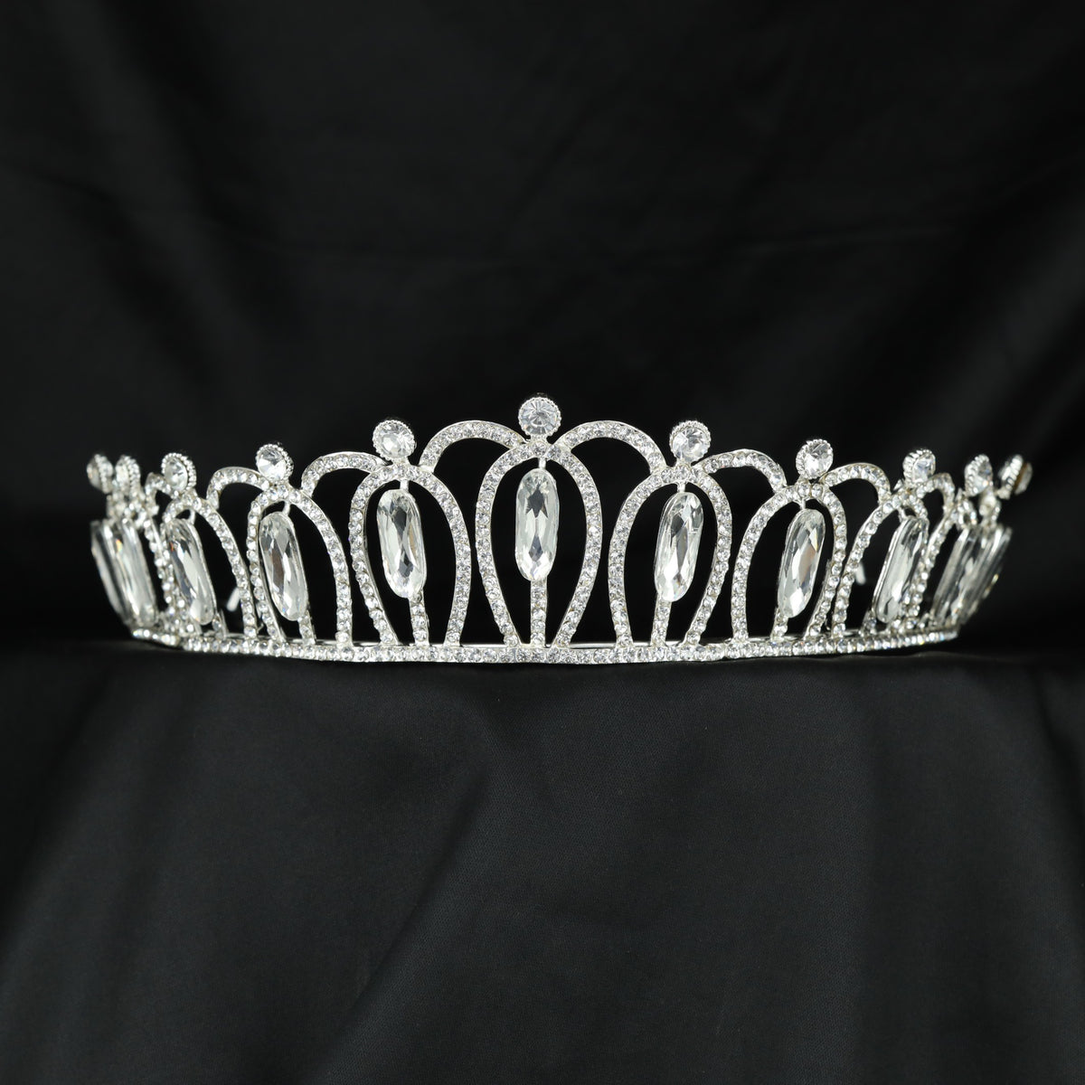 Grand Crown featuring graceful openwork arches and elongated raised details