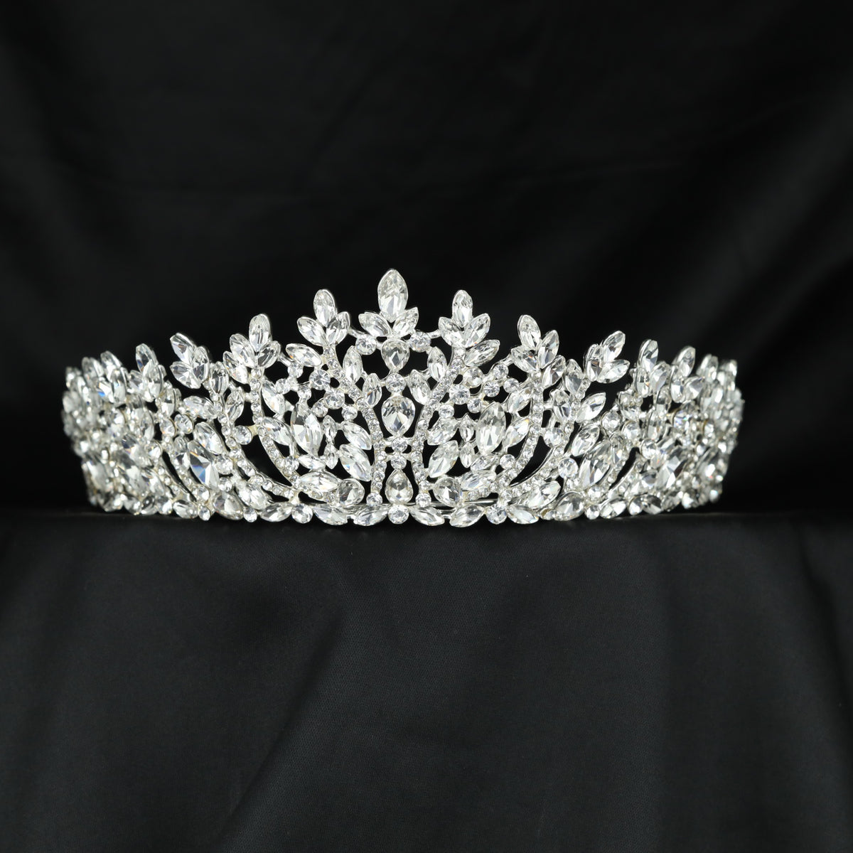 Grand Crown featuring elegant floral openwork and refined leaf accents