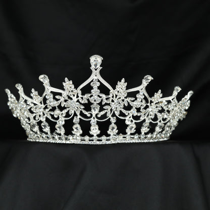 Premium Crown featuring intricate floral arrangements, flowing openwork and an elevated centre design