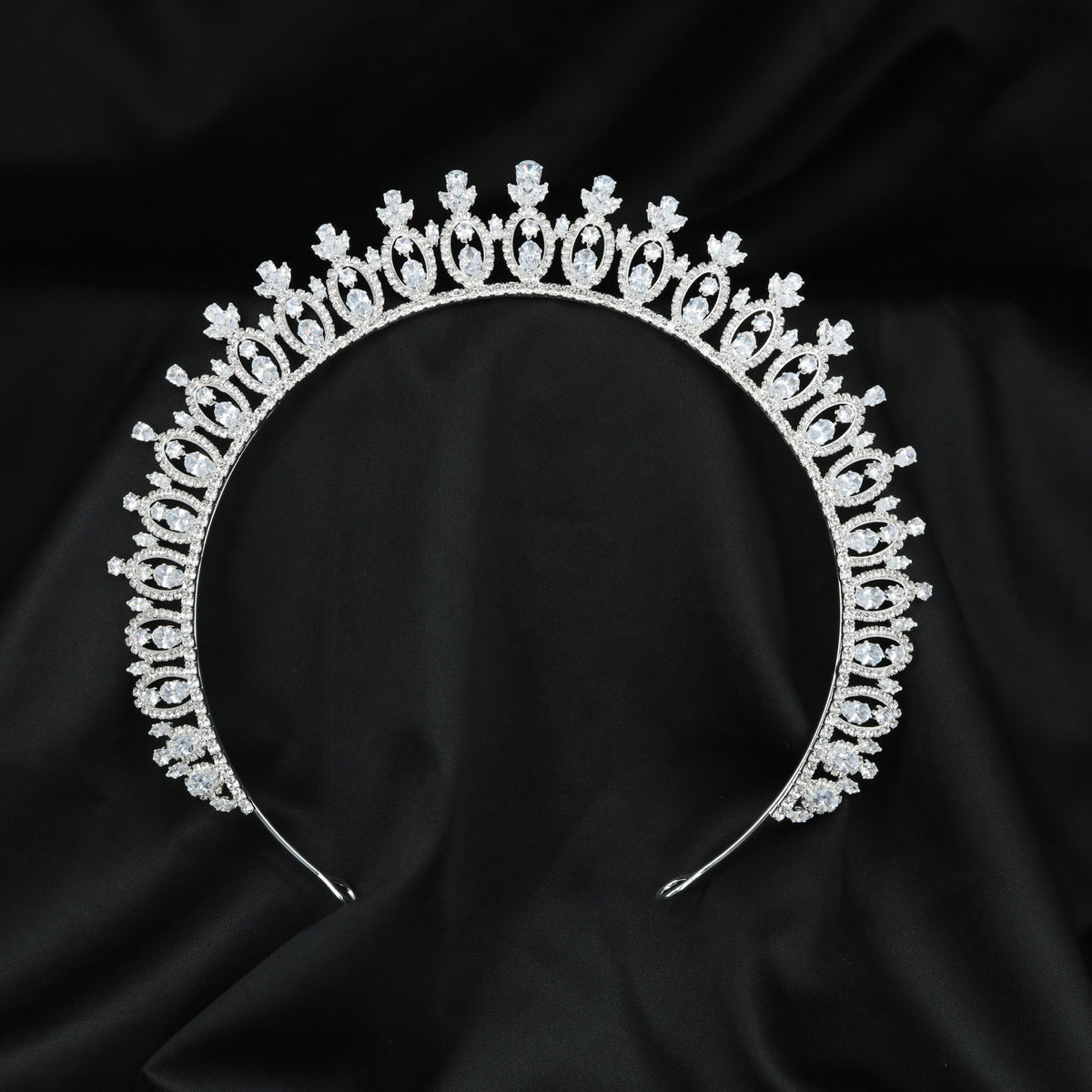 Vintage-inspired Crown with intricate arched frames and refined elevated accents